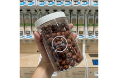 Image Hazelnuts in reusable jar in supermarket.